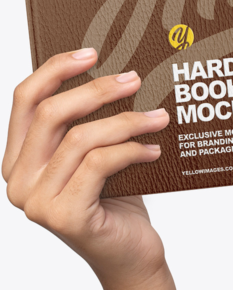 Leather Hardcover Book in a Hand Mockup Leather Hardcover Book in a Hand Mockup