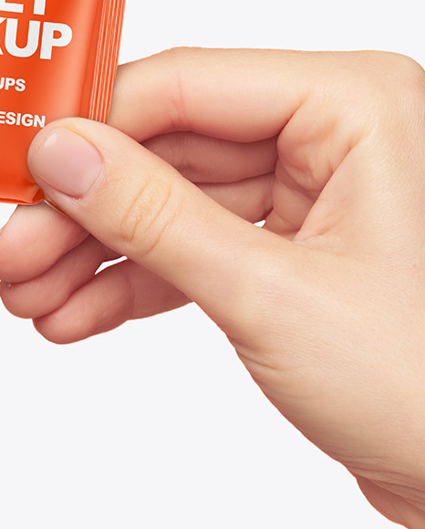 Glossy Sachet in a Hand Mockup PSD #1