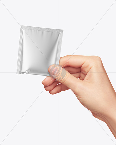 Metallic Sachet in a Hand Mockup PSD #3