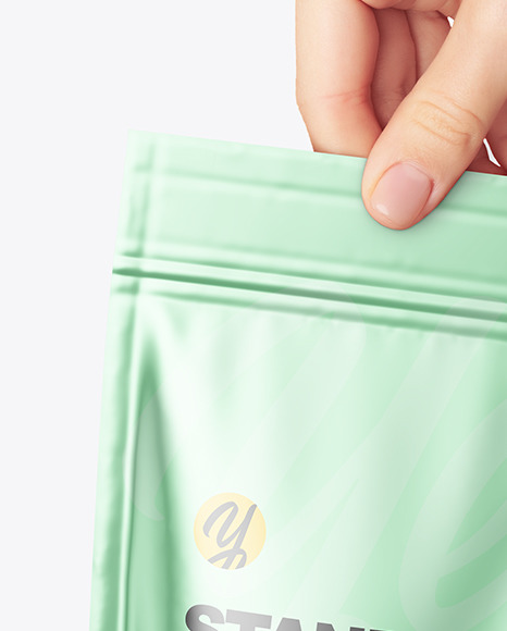 Metallic Stand up Pouch in a Hand Mockup PSD #1