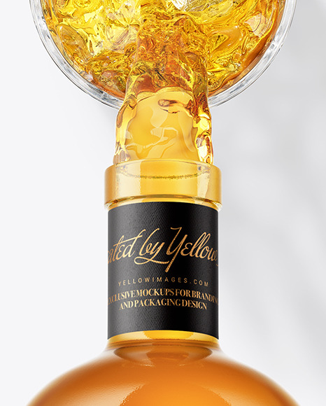 Whisky Bottle in a Hand Mockup