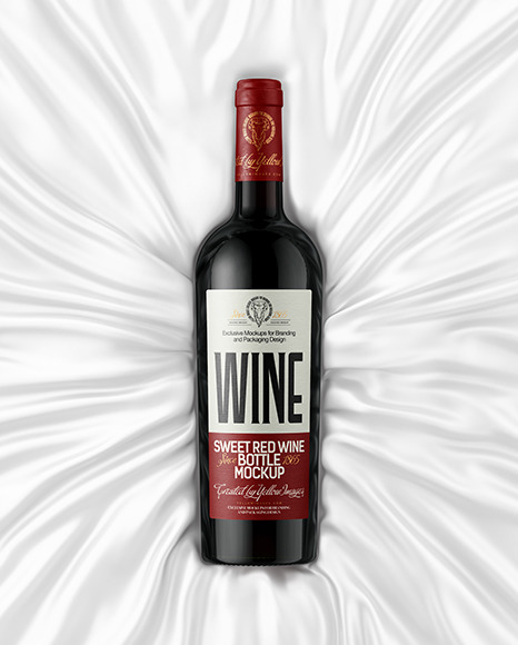 Green Glass Red Wine Bottle Lying on a Silk Cloth Mockup