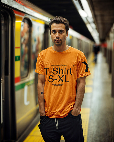 A Man Stands in The Subway Wearing a T-Shirt  and Sweatpants Mockup