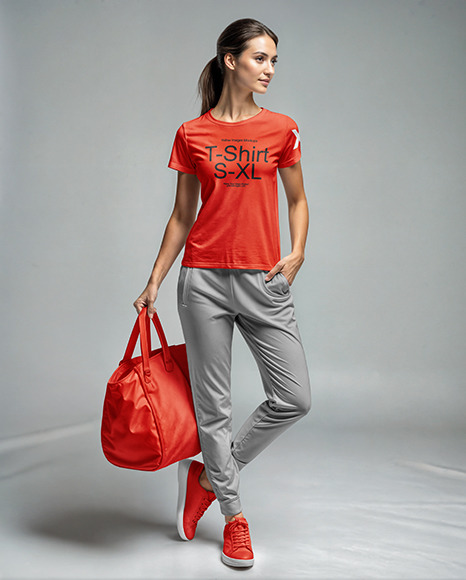 Young Woman Wearing a T-Shirt and Sweatpants with a Bag Mockup