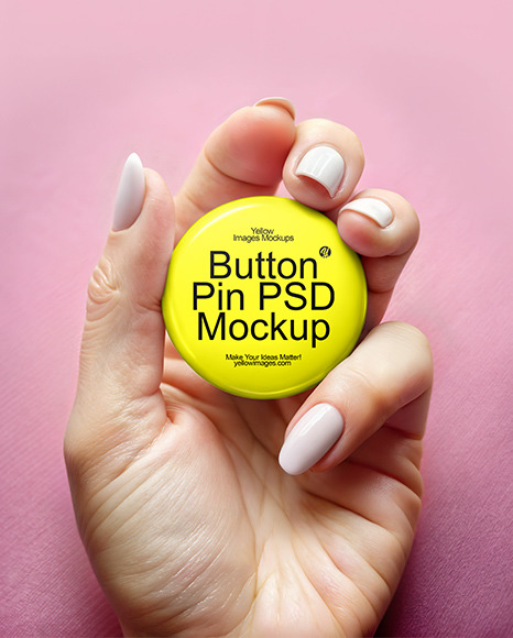 Woman's Hand Holding a Pin-Back Button Mockup