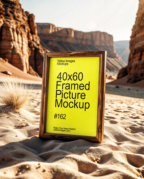 Wooden Framed Poster with Canyon in the Background Mockup