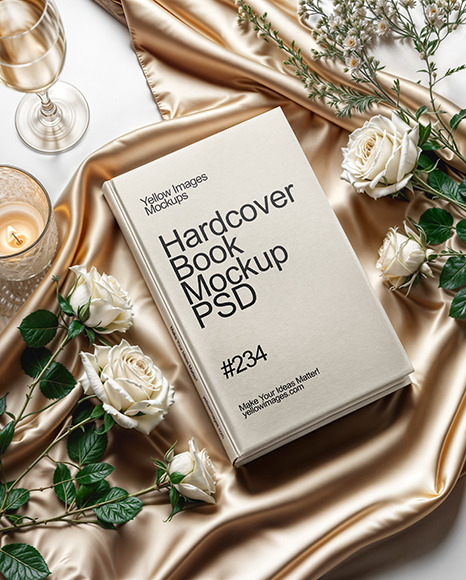 Hardcover Book on a Table with Flowers Mockup