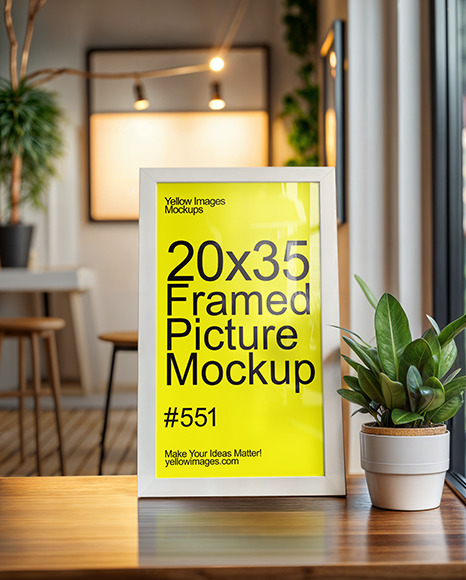 White Framed Picture on a Wooden Table in Cafe Interior Mockup