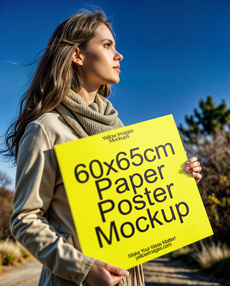 Woman in a Topcoat Holding Paper Poster Mockup