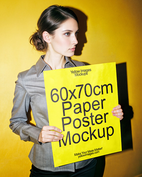 Woman in a Shirt Holding Paper Poster Mockup