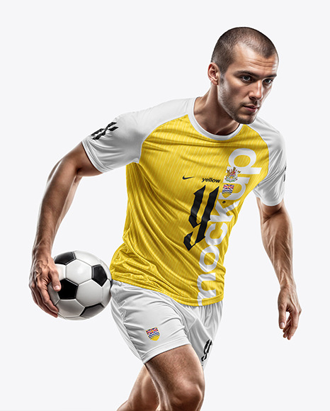 A Man with a Ball Wearing a Soccer Raglan Jersey and Shorts Mockup