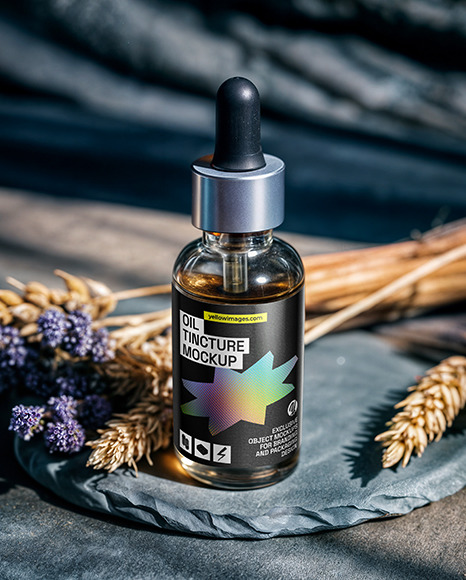 Oil Tincture Dropper Bottle on a Stone Plate with Herbs Mockup