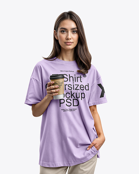 Young Woman Wearing an Oversize T-Shirt Holds a Coffee Cup in a Hand Mockup