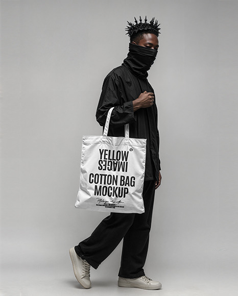 Black Man with Tote Bag Wearing a Black Shirt and Pants Mockup