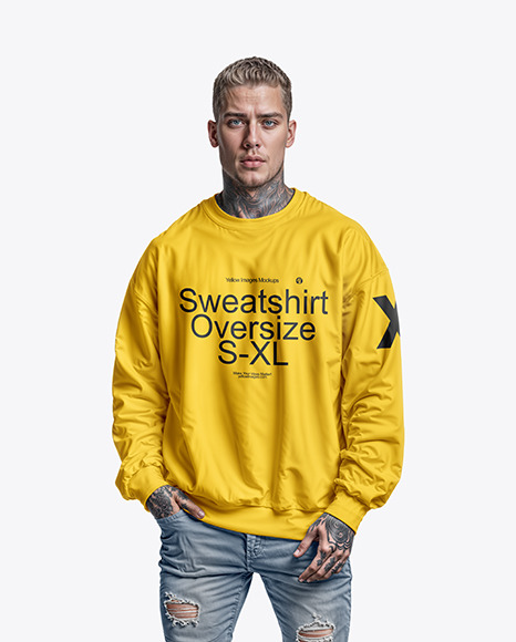 A Man with Tattoos Wearing an Oversize Sweatshirt and Jeans Mockup