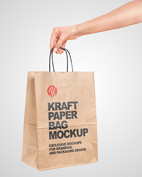 Hand Holding a Paper Bag Mockup PSD #7