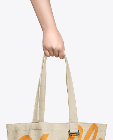 Download Cotton Bag In A Hand Mockup In Apparel Mockups On Yellow Images Object Mockups