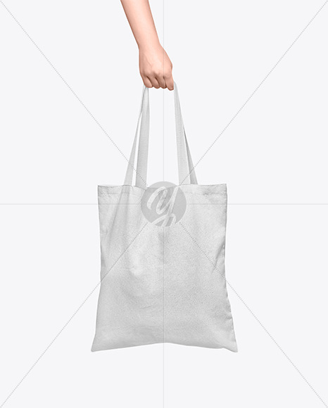 Download Cotton Bag In A Hand Mockup In Apparel Mockups On Yellow Images Object Mockups