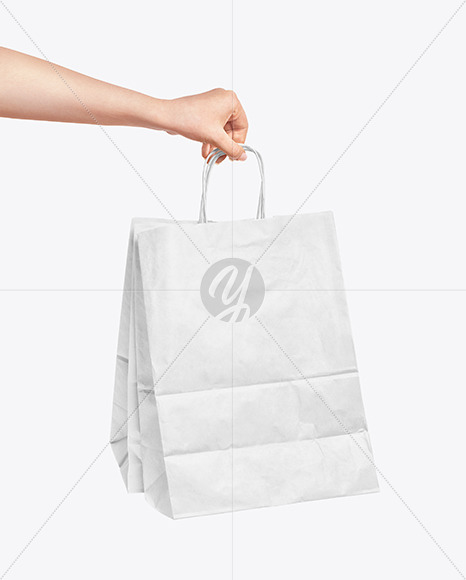 Download Hand Holding A Paper Bag Mockup In Packaging Mockups On Yellow Images Object Mockups PSD Mockup Templates