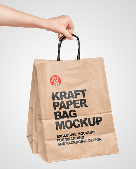 Hand Holding A Paper Bag Mockup In Packaging Mockups On Yellow Images Object Mockups