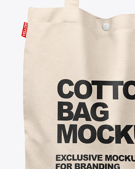 Download Cotton Bag in a Hand Mockup in Apparel Mockups on Yellow ...