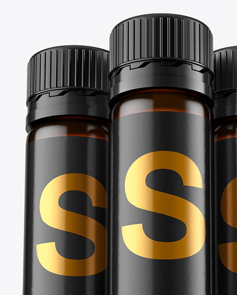 Three 25ml Dark Amber Sport Nutrition Bottles Mockup PSD #1